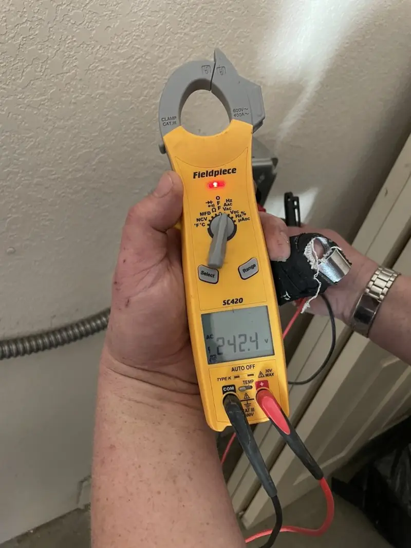 Voltage testing with clamp meter during Outlet Installation in Middle Smithfield